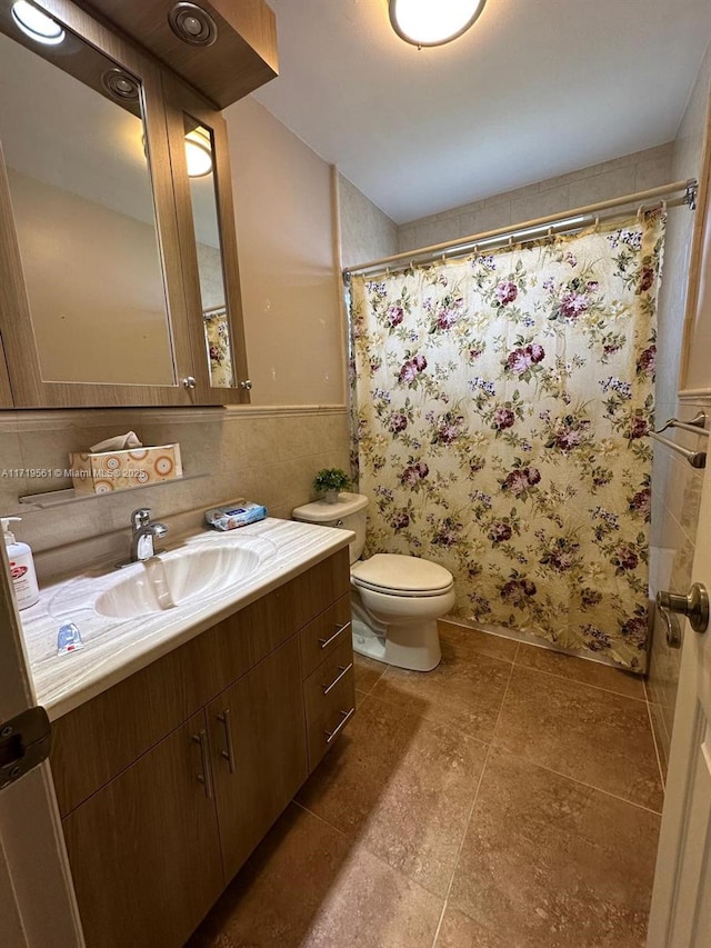 bathroom featuring vanity, toilet, and walk in shower