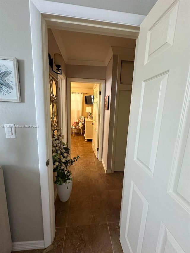 hall featuring dark tile patterned floors