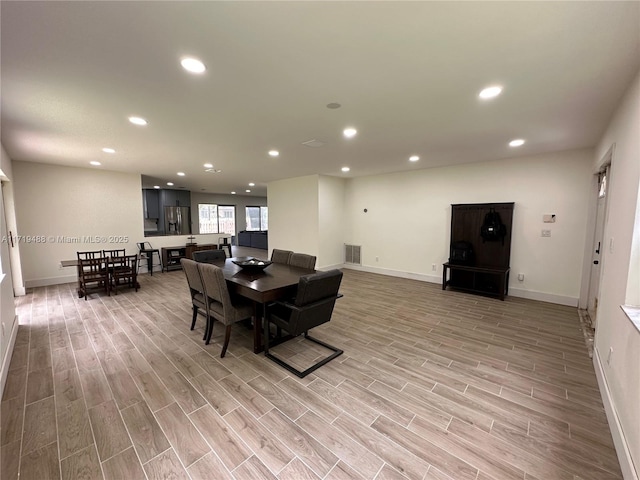 dining room with light hardwood / wood-style floors