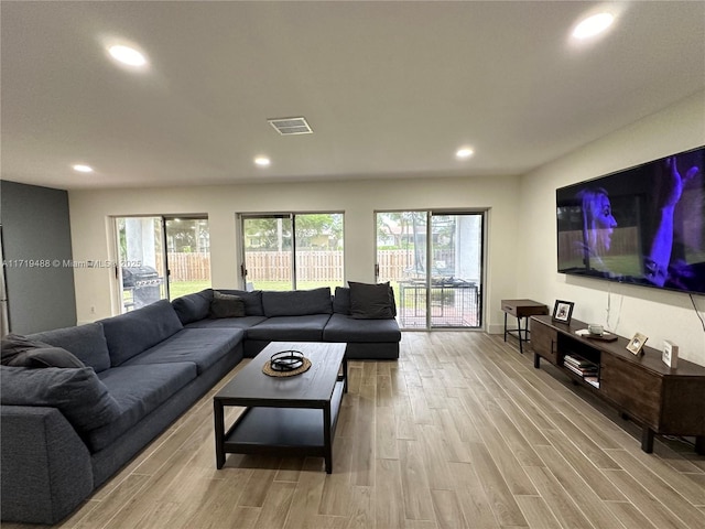 living room with light hardwood / wood-style floors