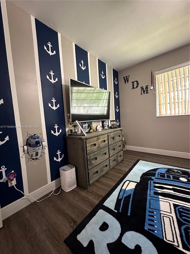 bedroom with dark wood-type flooring