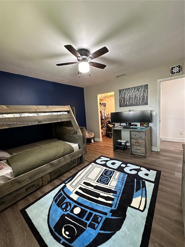 living room featuring hardwood / wood-style floors and ceiling fan