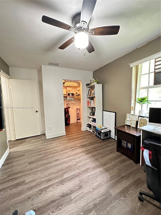 interior space featuring hardwood / wood-style flooring and ceiling fan