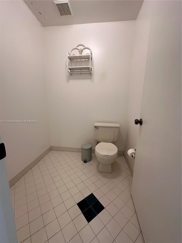 bathroom featuring tile patterned floors and toilet