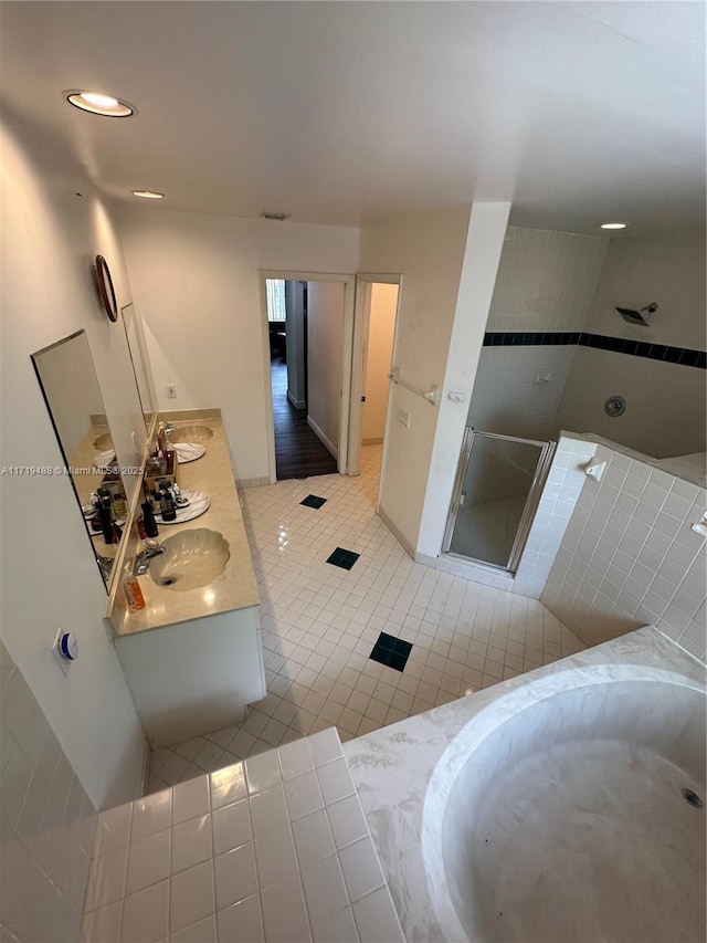 bathroom featuring tile patterned floors, vanity, and independent shower and bath