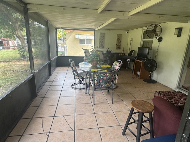 sunroom with beam ceiling