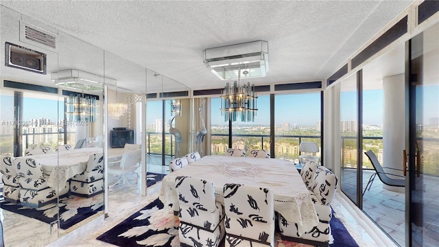 sunroom featuring a chandelier