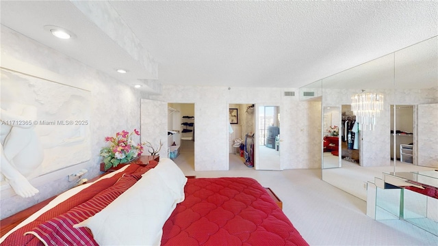 bedroom featuring a textured ceiling and a closet