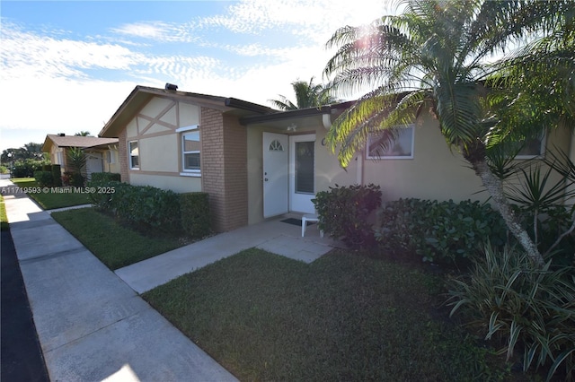 view of front of home with a front lawn