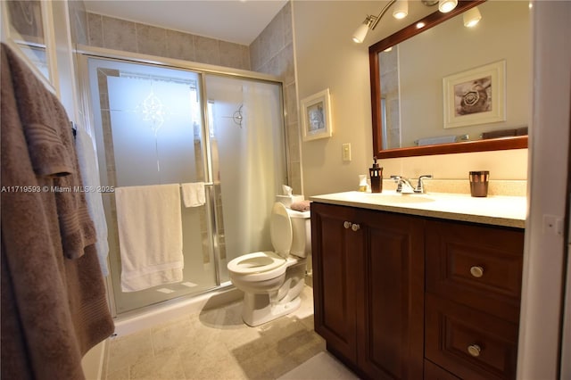 bathroom with vanity, toilet, an enclosed shower, and tile patterned flooring