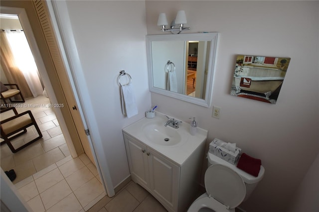 bathroom featuring tile patterned floors, toilet, and vanity