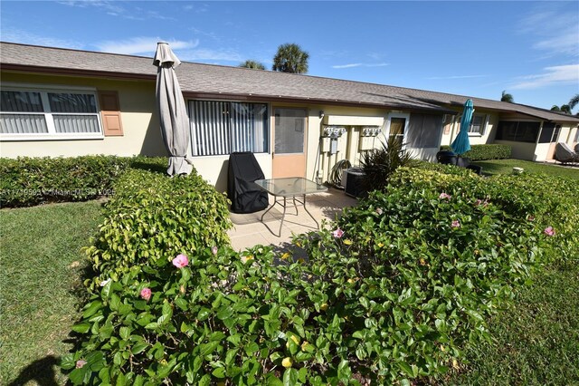 rear view of property with a patio