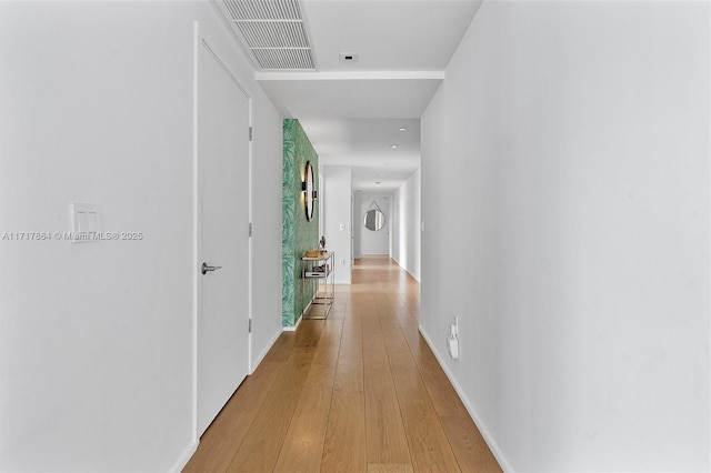 corridor with light wood-type flooring