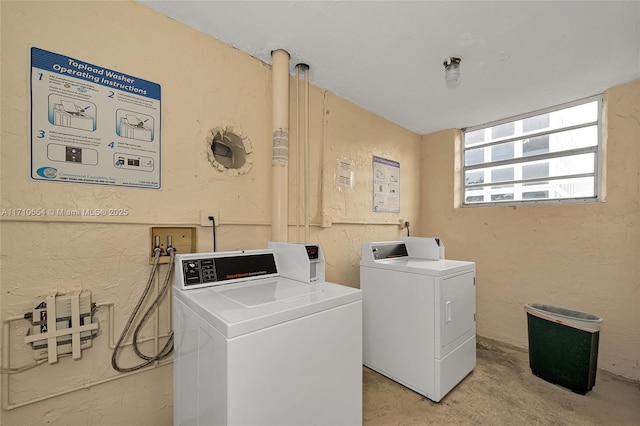 laundry area with independent washer and dryer