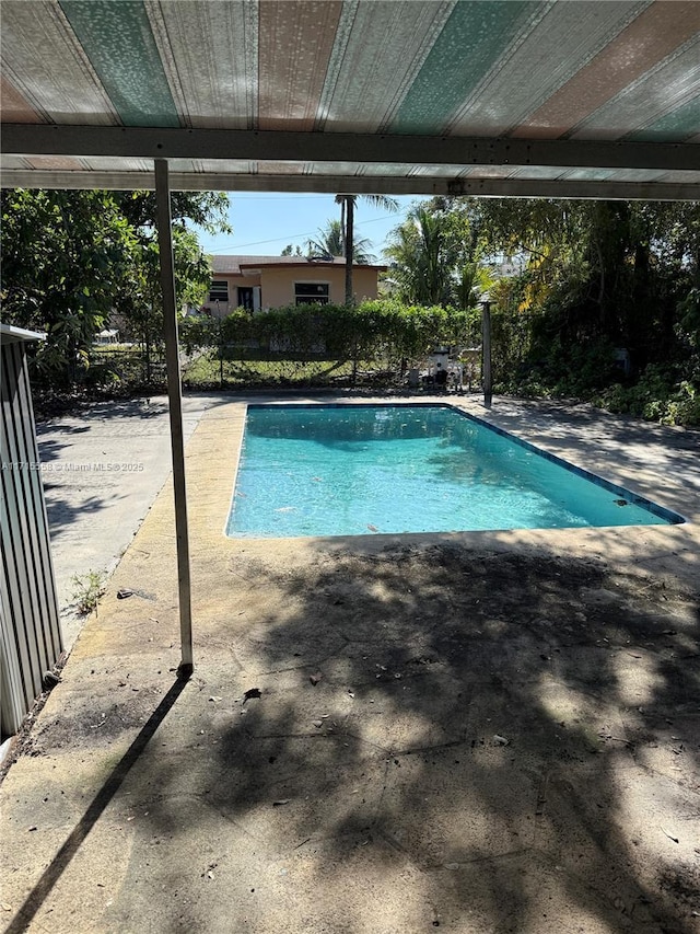 view of swimming pool featuring a patio area