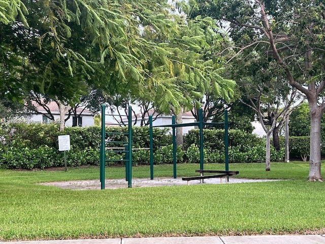 surrounding community with a playground and a yard