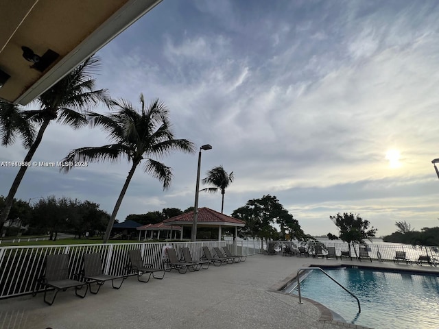 view of swimming pool with a gazebo and a patio