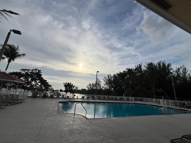 view of swimming pool featuring a patio area