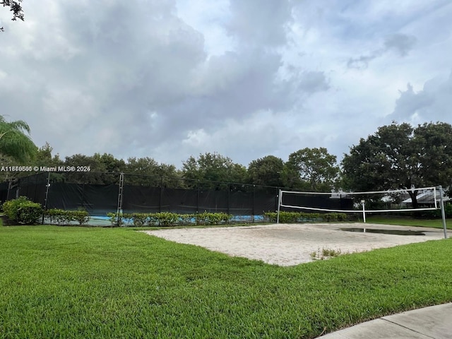 view of property's community featuring volleyball court and a yard