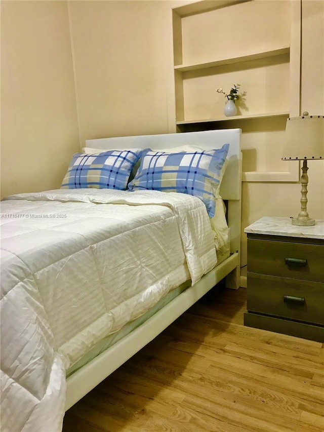 bedroom with light hardwood / wood-style floors