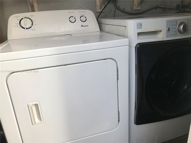 washroom featuring washer and clothes dryer