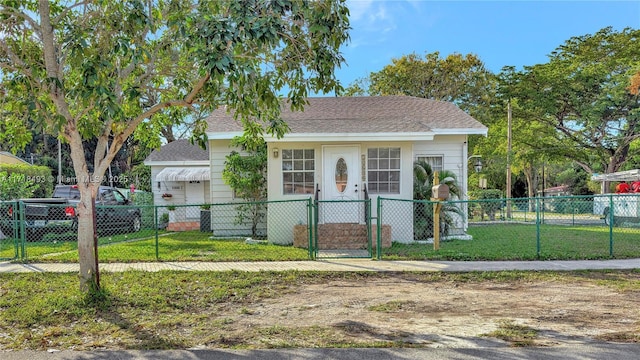 bungalow-style home featuring a front lawn