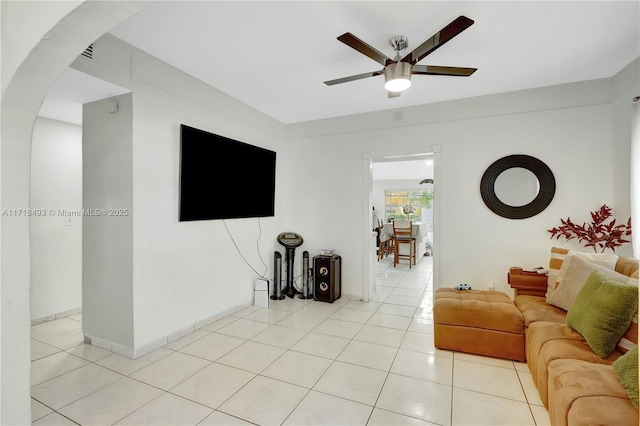 living room with ceiling fan and light tile patterned floors