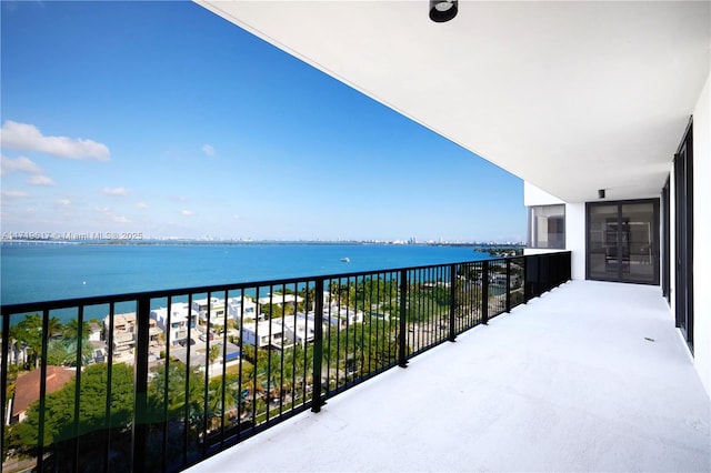 balcony featuring a water view