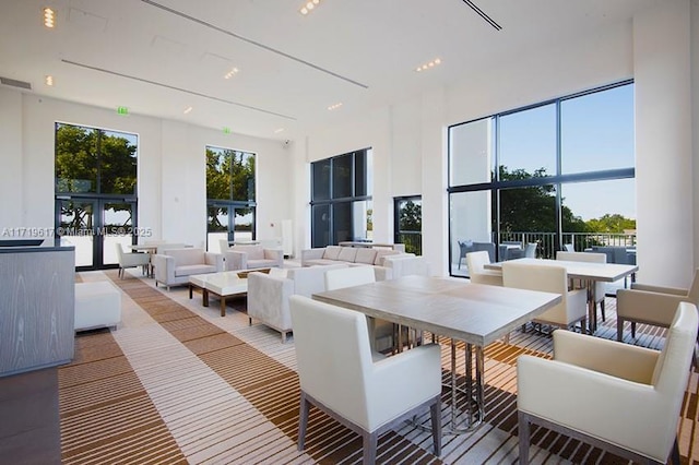 interior space with a high ceiling and french doors