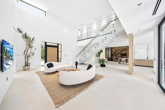 living room with a towering ceiling