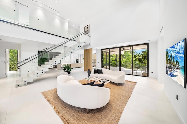 living room with a towering ceiling