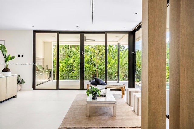 doorway to outside featuring floor to ceiling windows