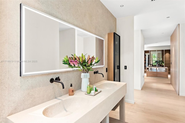 bathroom featuring hardwood / wood-style floors and vanity