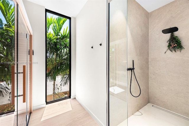 bathroom featuring hardwood / wood-style flooring and a wealth of natural light