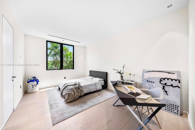 bedroom with light hardwood / wood-style floors