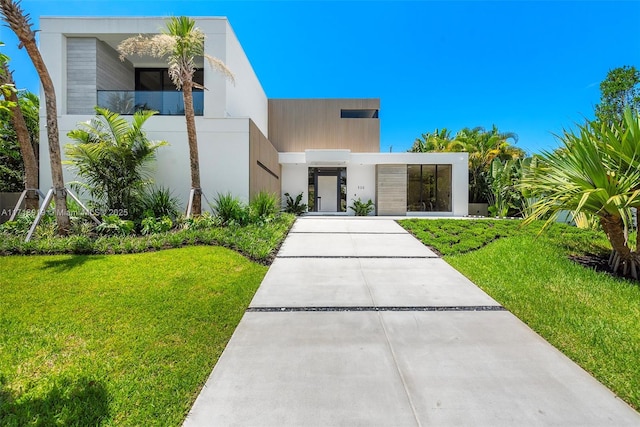 contemporary home featuring a front yard