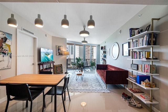 tiled dining area with a wall of windows