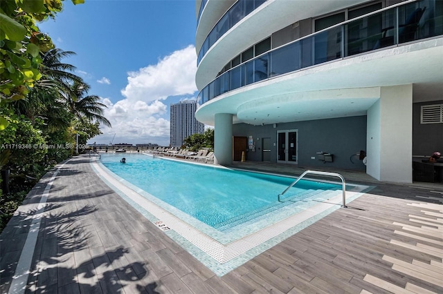 view of pool with french doors