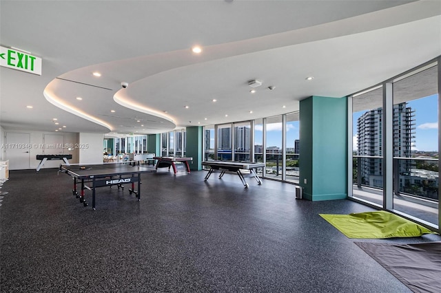 game room featuring expansive windows and billiards