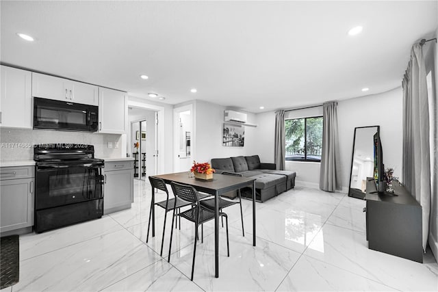 dining area featuring an AC wall unit