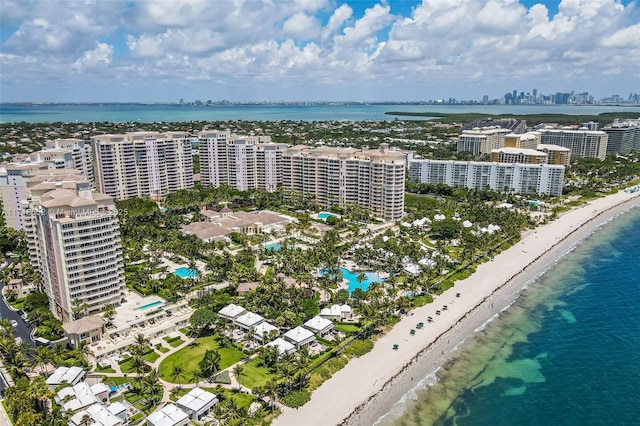 bird's eye view featuring a view of the beach and a water view