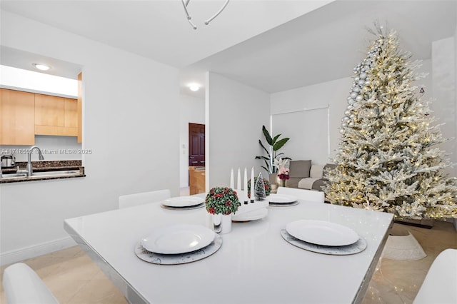 dining room with light tile patterned flooring and sink