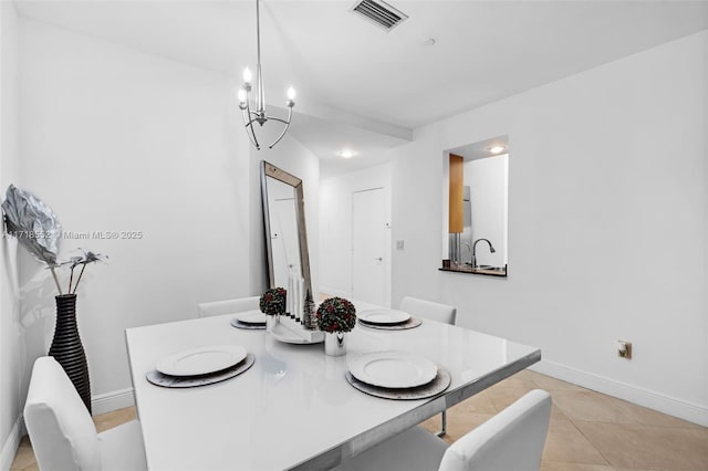 tiled dining area featuring a notable chandelier