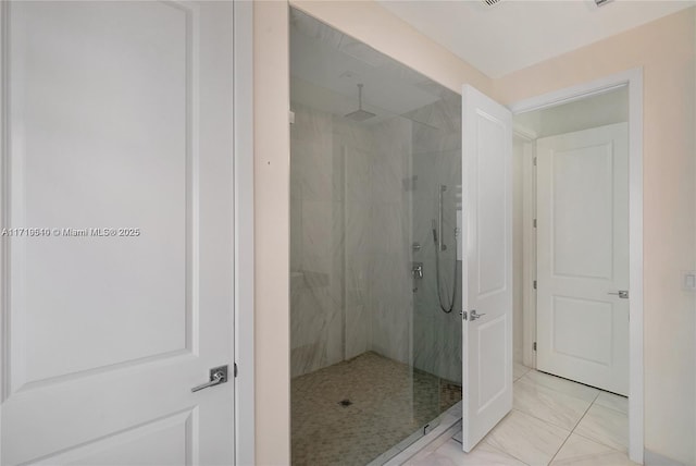 bathroom with tiled shower