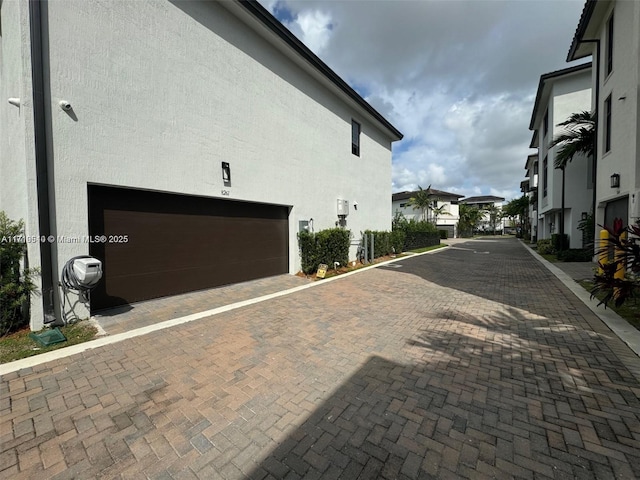 view of side of property with a garage