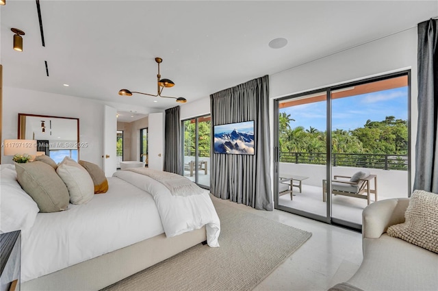 bedroom featuring access to outside and an inviting chandelier