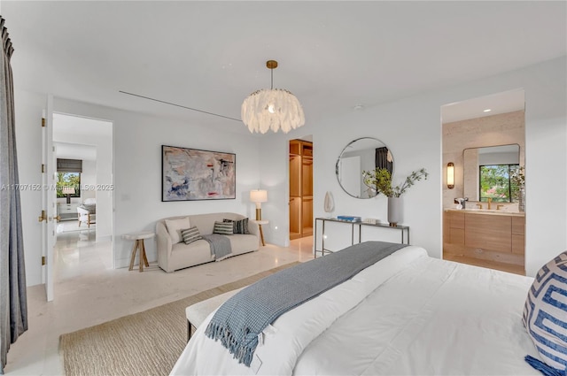 bedroom featuring multiple windows and ensuite bath