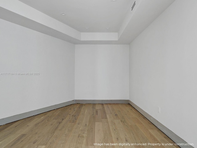 spare room featuring light hardwood / wood-style flooring