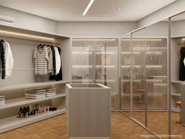 spacious closet with light parquet flooring