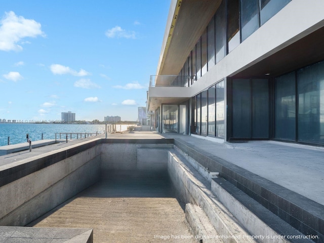 view of pool with a water view